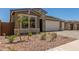 Charming home with well-manicured landscaping and a two-car garage at 18219 W Hess St, Goodyear, AZ 85338