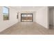 Spacious and bright living area with sliding glass doors providing ample natural light and access to the backyard at 18219 W Hess St, Goodyear, AZ 85338