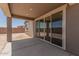 Covered patio with sliding glass doors offering seamless indoor-outdoor living at 18219 W Hess St, Goodyear, AZ 85338