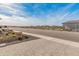 Landscaped front yard with paver driveway and desert plants at 18897 N 264Th Ln, Buckeye, AZ 85396