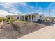 Single-story house with a covered patio and desert landscaping at 18897 N 264Th Ln, Buckeye, AZ 85396