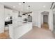 Modern kitchen with white cabinets, quartz counters, and island at 18897 N 264Th Ln, Buckeye, AZ 85396