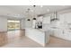 Modern kitchen with white cabinets, stainless steel appliances, and tile backsplash at 18897 N 264Th Ln, Buckeye, AZ 85396