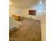 Living room features carpeted floors and an exterior door at 1945 W Sweetwater Ave # 2013, Phoenix, AZ 85029