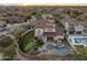 Aerial view of a luxurious house with a pool and lush landscaping at 20007 N 96Th Way, Scottsdale, AZ 85255