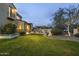 Landscaped backyard with a grassy area and mountain views at dusk at 20007 N 96Th Way, Scottsdale, AZ 85255