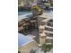 Outdoor kitchen and dining area next to the pool with tiled stairs at 20007 N 96Th Way, Scottsdale, AZ 85255