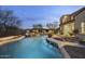 Stunning pool with a waterfall, swim-up bar, and mountain views at 20007 N 96Th Way, Scottsdale, AZ 85255