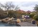 Relaxing spa with a waterfall feature and mountain views at 20007 N 96Th Way, Scottsdale, AZ 85255