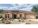 One-story home with stone accents and tile roof at 20233 W San Miguel Ave, Litchfield Park, AZ 85340