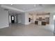 Spacious living room with tile floors, recessed lights, and an open floor plan to the kitchen at 20233 W San Miguel Ave, Litchfield Park, AZ 85340