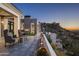 Relaxing patio with fire pit and mountain views at sunset at 21312 N 113Th Pl, Scottsdale, AZ 85255