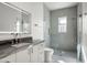 Modern bathroom with a walk-in shower and gray tile at 21312 N 113Th Pl, Scottsdale, AZ 85255