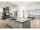 Modern kitchen with large island and high-end appliances at 21312 N 113Th Pl, Scottsdale, AZ 85255