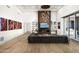 Modern living room with sectional sofa and a large fireplace at 21312 N 113Th Pl, Scottsdale, AZ 85255