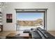 Living area with sectional sofa and sliding doors to a patio with mountain views at 21312 N 113Th Pl, Scottsdale, AZ 85255