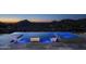 Infinity pool and spa with mountain views at sunset at 21312 N 113Th Pl, Scottsdale, AZ 85255