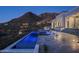 Stunning infinity pool and spa at night with mountain views at 21312 N 113Th Pl, Scottsdale, AZ 85255