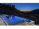 Night view of a luxurious infinity pool and spa at 21312 N 113Th Pl, Scottsdale, AZ 85255