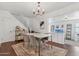 Elegant dining room featuring modern furnishings, hardwood floors, and a chandelier at 2209 E Weldon Ave, Phoenix, AZ 85016