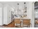 Modern kitchen featuring white cabinets, stainless steel appliances, and a breakfast bar at 2209 E Weldon Ave, Phoenix, AZ 85016