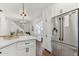 Contemporary kitchen with stainless steel refrigerator and adjacent staircase at 2209 E Weldon Ave, Phoenix, AZ 85016