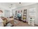 Inviting living room featuring a comfortable couch and decorative ladder shelves at 2209 E Weldon Ave, Phoenix, AZ 85016