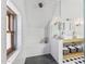 View of the updated attic bathroom featuring a glass shower with subway tile, checkered floors, and a double sink at 2209 E Weldon Ave, Phoenix, AZ 85016