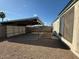 Backyard view showing covered parking and gravel at 2255 W Rose Garden Ln, Phoenix, AZ 85027