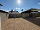 Gravel backyard with covered parking and block wall at 2255 W Rose Garden Ln, Phoenix, AZ 85027