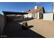 Backyard with gravel, covered parking, and storage shed at 2255 W Rose Garden Ln, Phoenix, AZ 85027