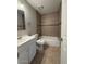 Updated bathroom with tub, toilet, and vanity at 2255 W Rose Garden Ln, Phoenix, AZ 85027