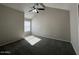 Bright bedroom featuring a ceiling fan and large window at 2255 W Rose Garden Ln, Phoenix, AZ 85027