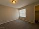 Bright bedroom with carpet, window, and closet at 2255 W Rose Garden Ln, Phoenix, AZ 85027