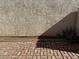 Brick patio next to a stucco wall at 2255 W Rose Garden Ln, Phoenix, AZ 85027