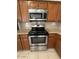 Stainless steel range and microwave in a modern kitchen at 2255 W Rose Garden Ln, Phoenix, AZ 85027