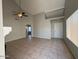 Bright and spacious living room with tile flooring and a ceiling fan at 2255 W Rose Garden Ln, Phoenix, AZ 85027