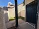 Small patio area with artificial turf and a door at 2255 W Rose Garden Ln, Phoenix, AZ 85027