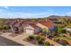 Aerial view of a single-story home with solar panels, a two-car garage, and a landscaped yard at 22992 W Lasso Ln, Buckeye, AZ 85326