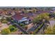 Aerial view showcasing a home's backyard oasis with patio and lush landscaping at 22992 W Lasso Ln, Buckeye, AZ 85326