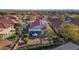 Aerial view showcasing a home's backyard oasis with patio and lush landscaping at 22992 W Lasso Ln, Buckeye, AZ 85326