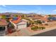 Aerial view of a single-story home with solar panels and a landscaped backyard at 22992 W Lasso Ln, Buckeye, AZ 85326