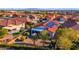 Aerial view showcasing a home's backyard oasis with patio and lush landscaping at 22992 W Lasso Ln, Buckeye, AZ 85326