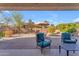 Relaxing backyard patio with seating and umbrella at 22992 W Lasso Ln, Buckeye, AZ 85326