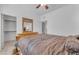 Bedroom with wooden bed frame and private closet at 22992 W Lasso Ln, Buckeye, AZ 85326