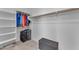 Large walk-in closet with shelving and hanging rods at 22992 W Lasso Ln, Buckeye, AZ 85326