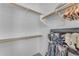 Spacious closet with wood shelving and hanging rods at 22992 W Lasso Ln, Buckeye, AZ 85326