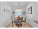 Cozy dining area with a wooden table and wrought iron chairs at 22992 W Lasso Ln, Buckeye, AZ 85326