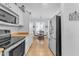 Kitchen with stainless steel appliances and white cabinets at 22992 W Lasso Ln, Buckeye, AZ 85326