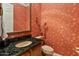 Stylish half bathroom with floral wallpaper and dark granite countertop at 2310 W Hazelhurst Dr, Anthem, AZ 85086